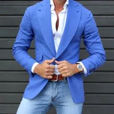 Man wearing a custom bright blue blazer paired with jeans, representing stylish smart casual bespoke tailoring at From Collars to Cuffs in Weston, Florida
