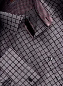 Close-up detail of a custom grey windowpane check dress shirt with silver cufflinks, showcasing premium fabric texture and personalized tailoring details at From Collars to Cuffs in Weston, Florida
