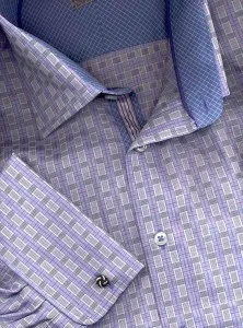 Close-up of a custom purple geometric pattern dress shirt with contrasting blue inner collar and cuff, showcasing personalized detailing and fabric layering at From Collars to Cuffs in South Florida
