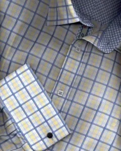 Detail of a custom yellow and blue plaid dress shirt showing crisp collar and cuff construction, representing premium fabric selection and pattern craftsmanship at From Collars to Cuffs in Florida