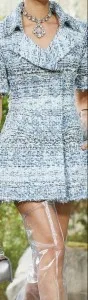 Woman wearing a custom blue tweed dress with a classic collar and necklace, showcasing Chanel-inspired tailoring and luxury bouclé fabrics at From Collars to Cuffs in South Florida