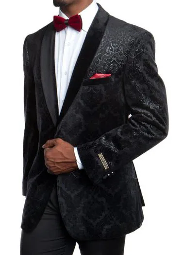 Man in a custom black tuxedo jacket with subtle tonal pattern, burgundy bow tie, and matching pocket square, representing unique bespoke formal styling at From Collars to Cuffs in Weston, Florida.