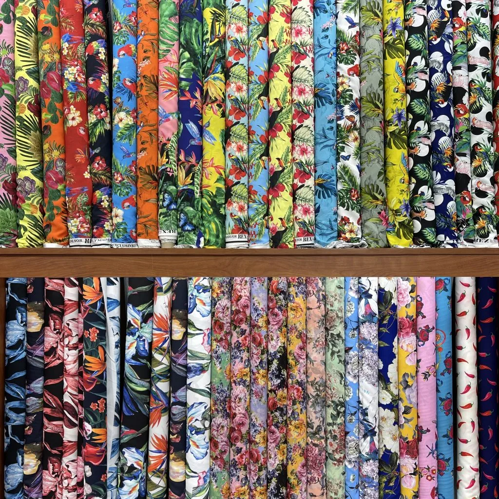 Extensive fabric collection featuring cotton shirting, tuxedo fabrics, linens, Swiss voile, Italian Cashmere, Gabardine, and designer materials from Scabel, Loro Piana, Dormeuil, Pucci, Versace, and Armani at From Collars to Cuffs boutique in Weston, Florida.