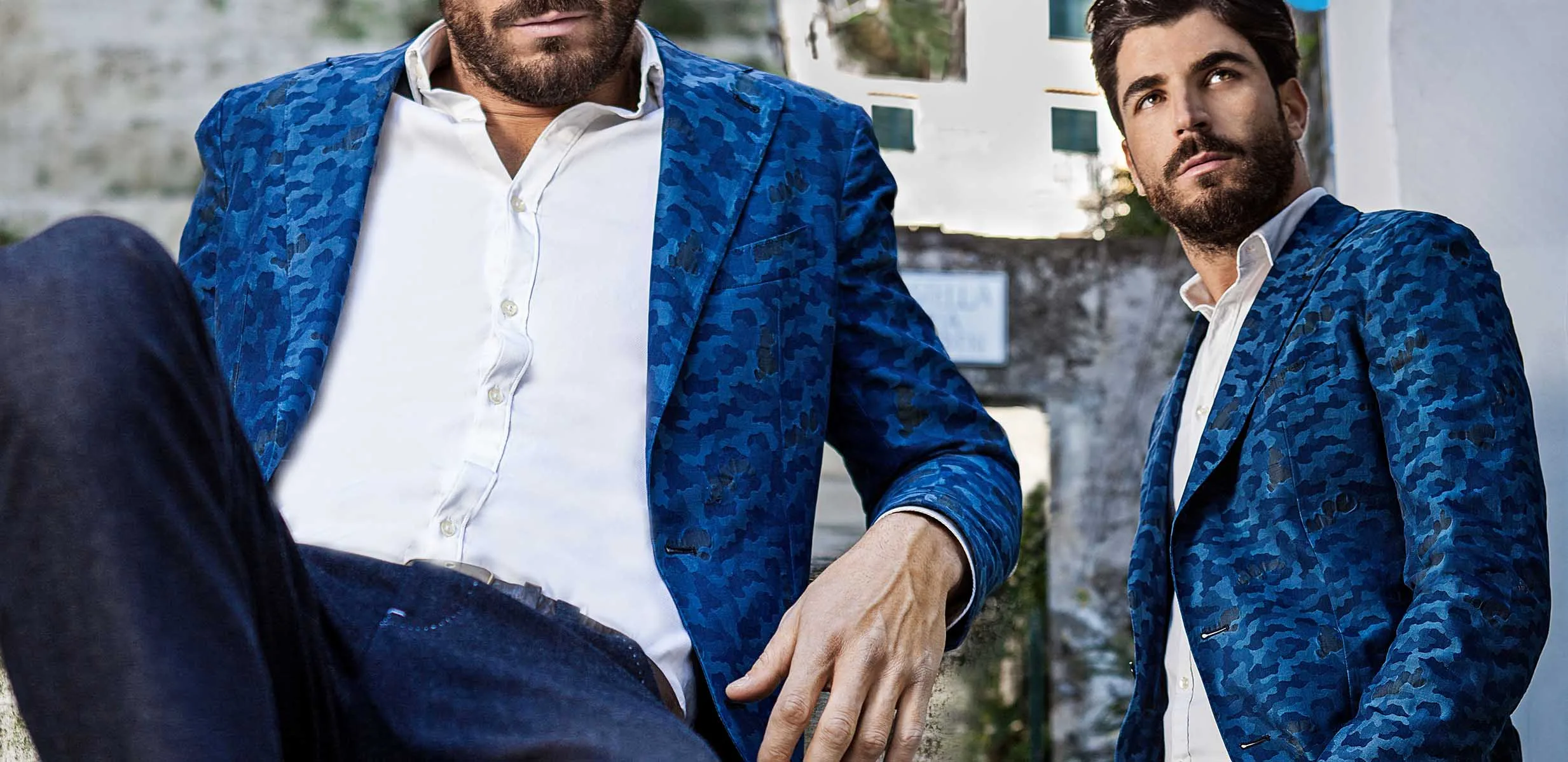 Man wearing a custom-tailored blue camouflage sport jacket and white dress shirt, showcasing luxury bespoke menswear at From Collars to Cuffs in Weston, South Florida